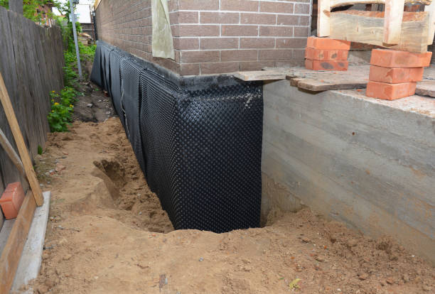 SJ Waterproofing Pros technician performing targeted Emergency Waterproofing assessment in Streamwood, IL